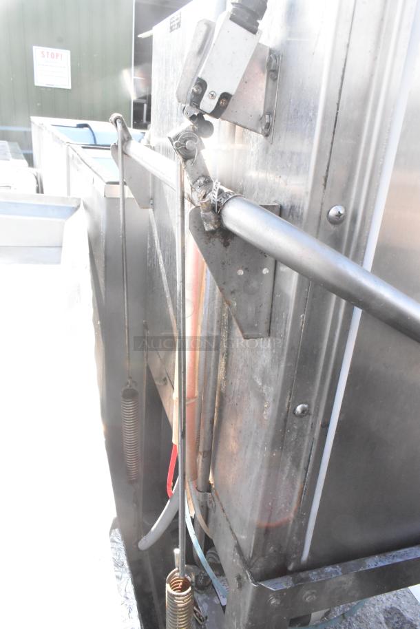 CMA AH-2 Commercial Floor Style Dishwasher, 115V, 1 Phase, stainless steel, visible wear, model details on side.