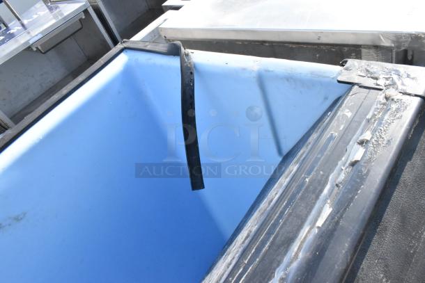 Ice-O-Matic Commercial Ice Bin with a blue interior. Shows signs of wear on the edges and a damaged sealing strip.
