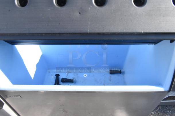 Ice-O-Matic Commercial Ice Bin with visible brand label, large interior, in fair condition with minor scuffs.