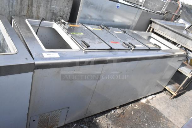 Kelvinator Commercial Chest Freezer, stainless steel, on casters, 208-230V, 1 phase, visible wear, labeled compartments.