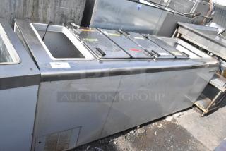 Kelvinator Commercial Chest Freezer, stainless steel, on casters, 208-230V, 1 phase, visible wear, labeled compartments.