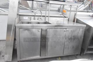 Commercial stainless steel 3 bay sink with over shelf and 3 doors. Includes faucet, visible wear, ideal for restaurant use.