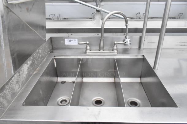 Commercial 3 bay sink with over-shelf, stainless steel, faucet, and visible wear. Includes three doors, suitable for kitchens.