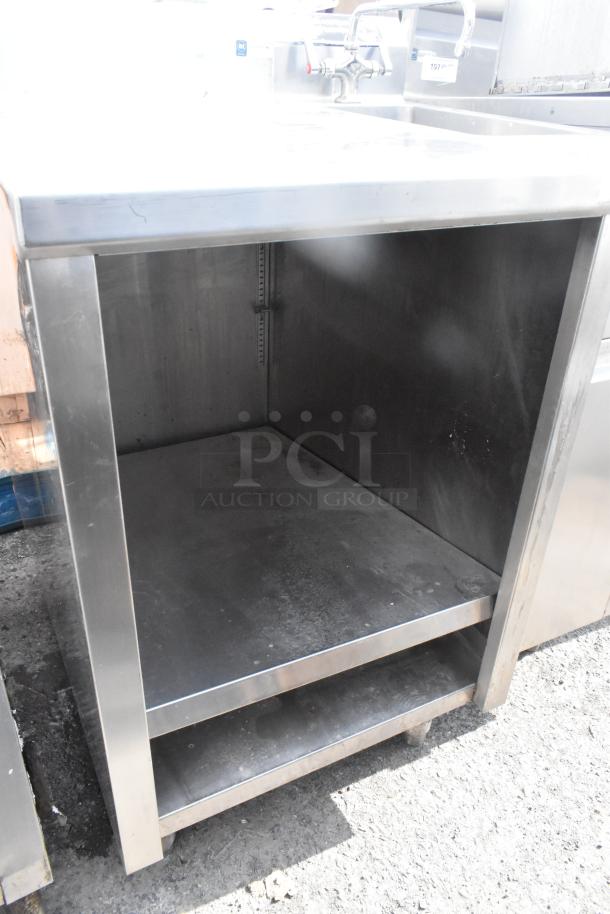 Commercial single bay sink with under shelf, stainless steel, used condition, features dual faucets, sturdy construction.