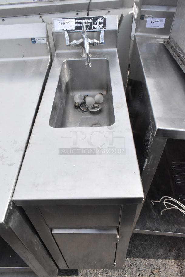 Commercial single bay sink with lower door, stainless steel, faucet included, visible wear, auction tag attached.