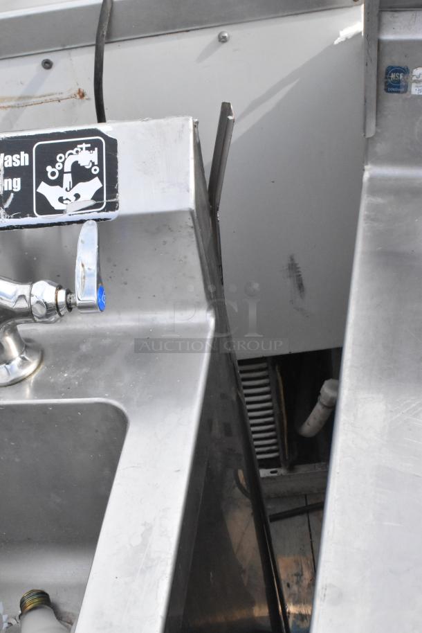 Commercial single bay stainless steel sink with faucet, lower storage door, and handwashing sign. Good condition.