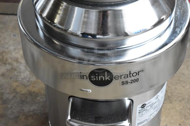 Brand new 2022 InSinkErator SS-200-35 commercial garbage disposer, stainless steel, 208/230/460V, 3 phase, minor dents.