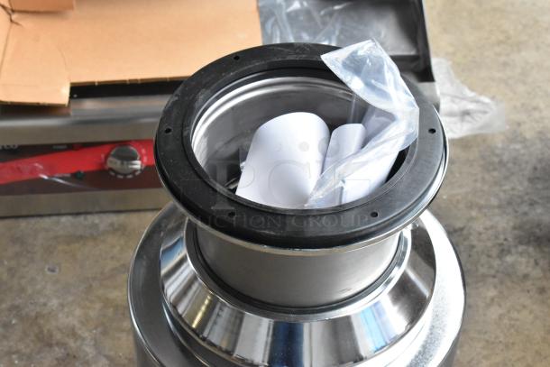 Brand new InSinkErator SS-200-35 commercial garbage disposer, 2022 model, with some cosmetic scratches and dents.