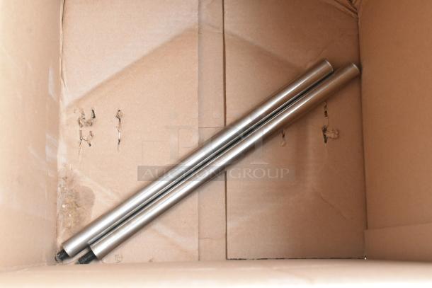 Two metal rods in a cardboard box, part of a BRAND NEW 2022 InSinkErator SS-200-35 Commercial Garbage Disposer, 3 Phase.