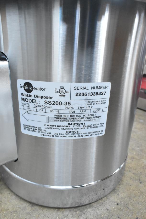 BRAND NEW 2022 InSinkErator SS-200-35 Commercial Garbage Disposer. Scratch and dent, 208/230/460V, 3 Phase. Label visible.