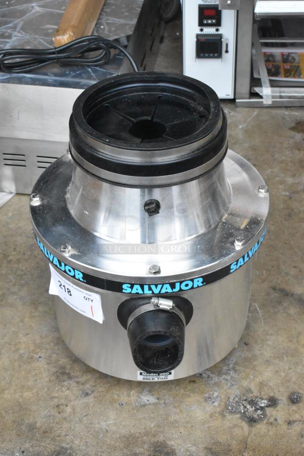 Brand new Salvajor 200 commercial garbage disposer with tags, 208/230/460V, 3-phase, slight scratches noted.