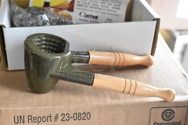 4 brand new K2811 Nut Master nutcrackers/bottle openers. Wood handles, metal body, in scratch and dent boxes.