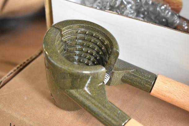 4 new K2811 Nut Master nutcracker/bottle openers, scratch and dent condition, with wooden handles.