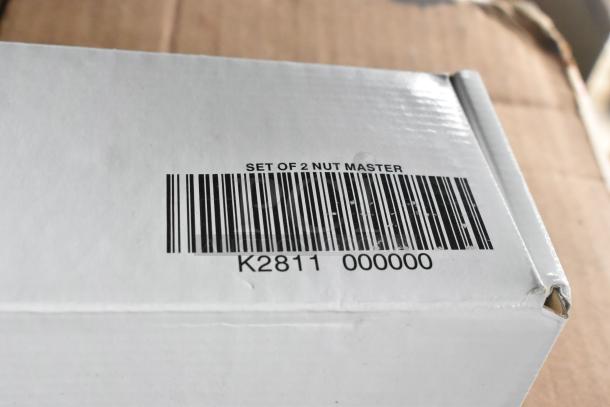 Four new boxes of K2811 Nut Master Nutcracker/Bottle Opener, slight scratches. Barcode reads "SET OF 2 NUT MASTER".