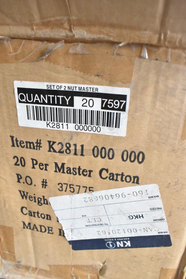 Boxes labeled K2811 Nut Master, new scratch and dent condition, for auction. Contains nutcracker/bottle openers.