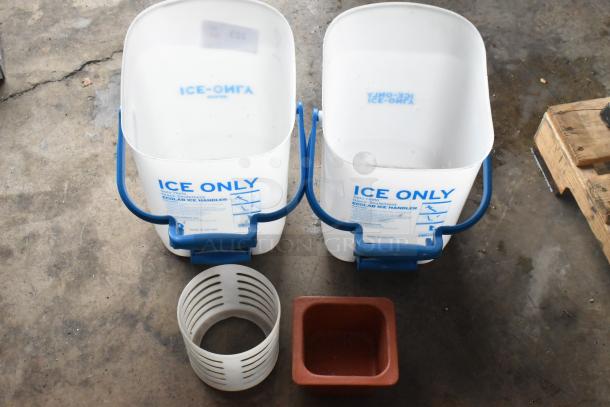 Two Ecolab poly ice buckets labeled "ICE ONLY," white plastic holder, and red square container on concrete floor.