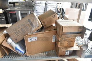 Boxes of new scratch and dent items, including Diversey cleaners and Delight creamer, stacked on a shelf. Labels visible.