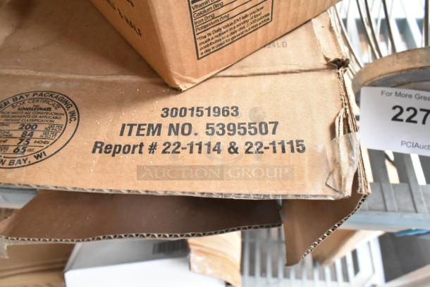 Cardboard box with item number 5395507 and report numbers 22-1114 & 22-1115 printed. Box part of a mixed lot auction.