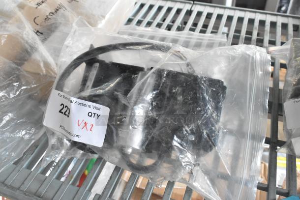 Clear poly bag containing Embraco XC4XD0FK and OL1653 metal pieces, labeled "2x" for auction lot 229.