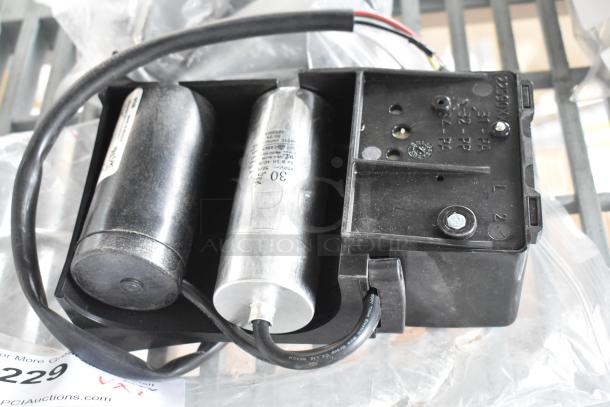 Two items featuring Embraco XC4XD0FK pump and OL1653 metal parts, showcasing wiring and condition for auction.