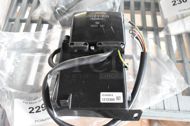 Embraco XC4XD0FK unit with wires, marked "SIDE UP." Includes label with code 1272399. Features PCI Auction tag.