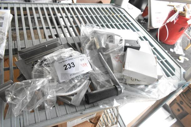 Nine assorted items including Accucold alarm, Robot Coupe blade, Bunn hose, and 2026 stickers, labeled "233 x9".