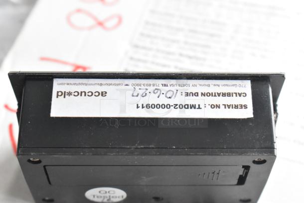 Accucold alarm module with serial TMD02-0000911, calibration due 10-2027, part of a 9-item auction lot. 