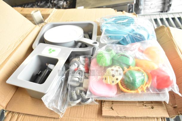 Lot of kids kitchen set accessories including Velcro cut produce, skillet, plastic screws in good condition.