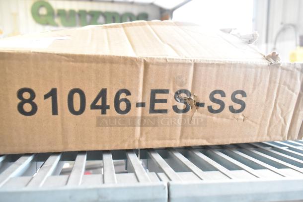 Cardboard box labeled "81046-ES-SS" containing a variety of kids kitchen set accessories, including velcro cut produce and plastic screws.