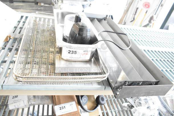 5-item lot: True cooler kickplate, drop-in bin, wire basket, food processor w/o lid. Condition varies. Auction tag visible.