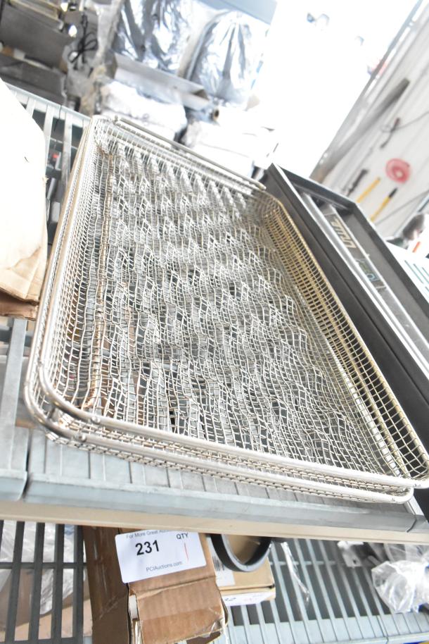 5-item lot including True cooler kickplate, drop-in bin, wire basket, and food processor without lid, on metal shelf.