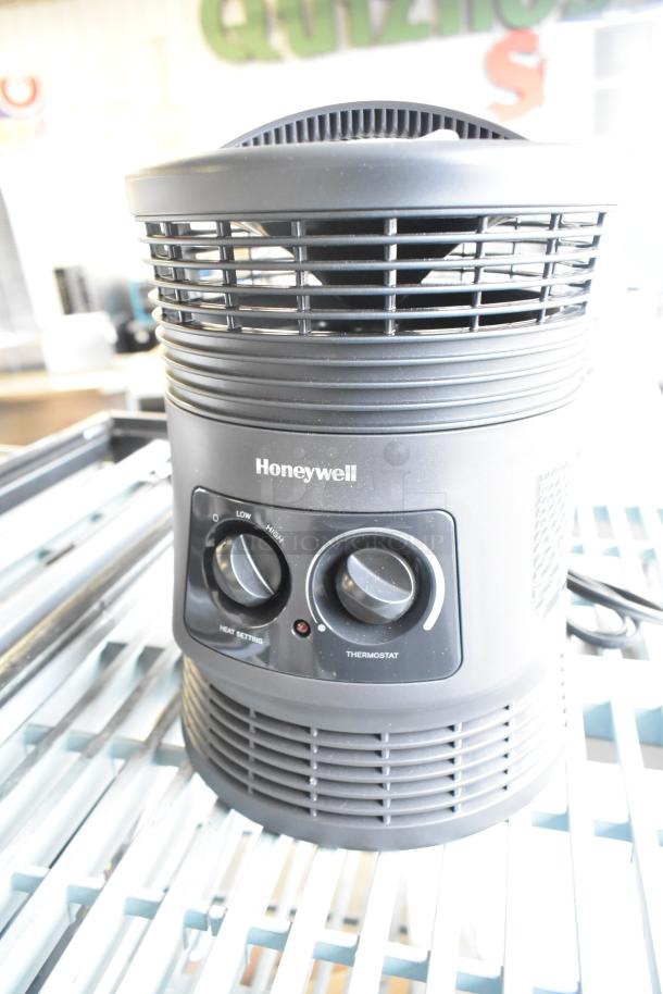 Honeywell HHF360VV2 Heater, 120V, 1 Phase. Dual control dials for heat and thermostat settings. Appears in good condition.