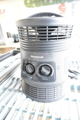 Honeywell HHF360VV2 Heater, 120V, 1 Phase. Dual control dials for heat and thermostat settings. Appears in good condition.