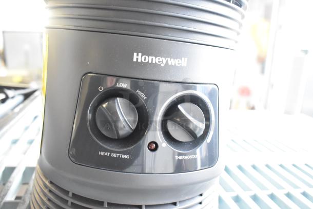 Honeywell HHF360VV2 Heater, black, 120 volts, controls for heat setting and thermostat visible, well-maintained condition.
