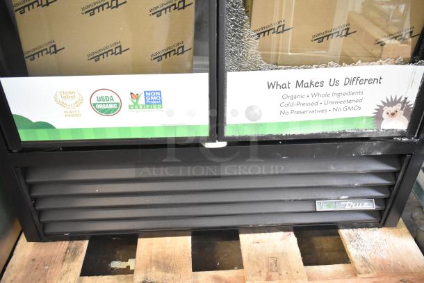 Brand new 2025 True TVM-48SL-HC commercial cooler with dents, visible True logo, and certifications. 115V, 1 Phase.