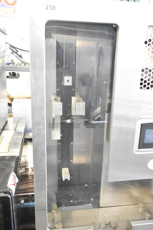 JBT 2ND-GEN-MFJ-HE Fresh N Squeeze commercial citrus juicer on casters, stainless steel, 115V, 1 Phase, excellent condition.