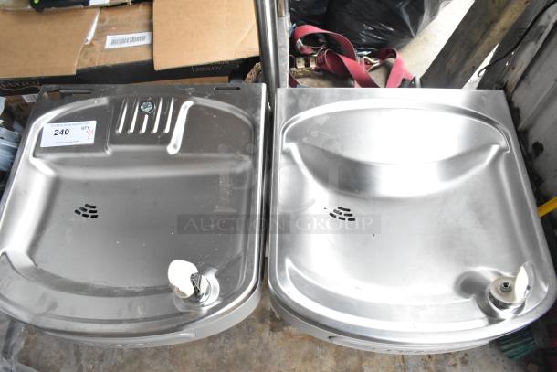 Two new Elkay wall mount water fountains, 115 volts, stainless steel, with minor scratches. Auction tag visible: "240".
