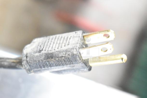 Alt text: Close-up of an electrical plug for an Elkay wall mount water fountain, 115 volts, 1 phase.