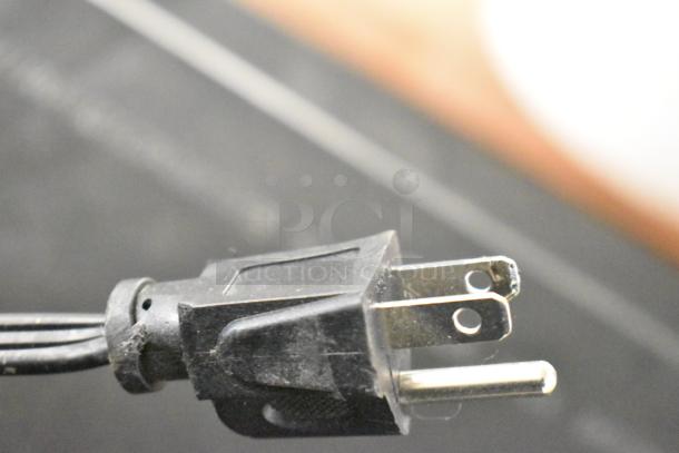 Hamilton Beach HB8436127995-02 Microwave power plug, 120 volts, showing condition of prongs and cord.