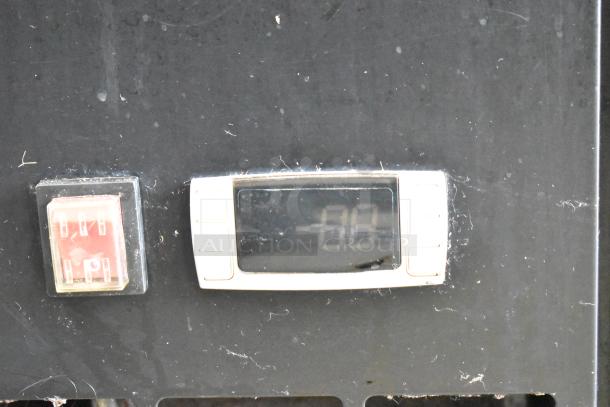 Avantco UBB-24-60G back bar cooler display panel showing temperature controls, slight wear visible, commercial use.