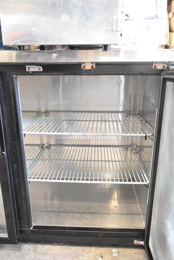 Avantco UBB-24-60G commercial 2-door back bar cooler with glass doors, metal shelves, 115 volts, 1 phase, good condition.