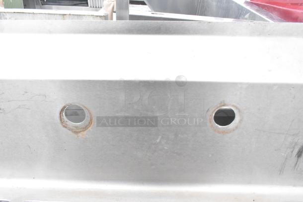 Commercial 3-bay sink with right side drain board, stainless steel, pre-owned condition, visible mounting holes.