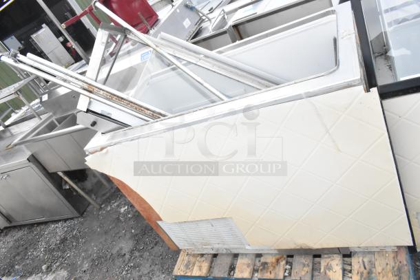 Commercial ice cream dipping cabinet, visible wear and rust, missing panel, on a wooden pallet, suitable for refurbishment.