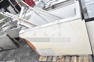 Commercial ice cream dipping cabinet, visible wear and rust, missing panel, on a wooden pallet, suitable for refurbishment.