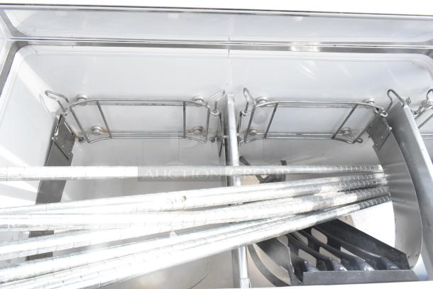 Commercial ice cream dipping cabinet with metal tub collars. Stainless interior, good condition, suited for retail use.