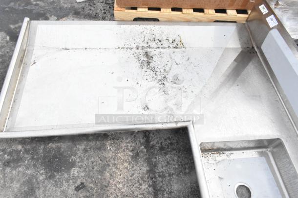 Brand new Regency 600DDTI72L 6' L-shape dishtable, 16-gauge stainless steel, minor scratches and dents, left island design.