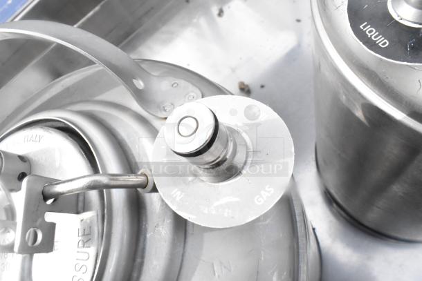 Two metal 3-gallon kegs with gas inlet valves, each marked "LIQUID" and "GAS," appear in used condition.