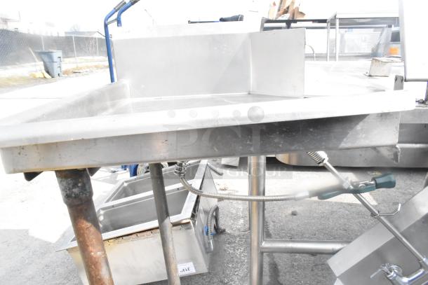 Commercial left side clean dish table, stainless steel, rust on leg, integrated splash guard, fair condition.