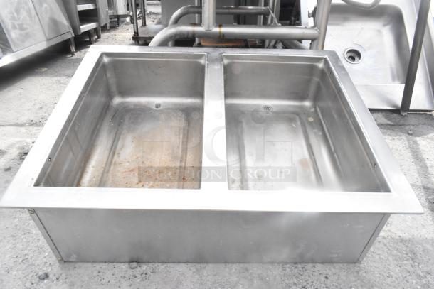 Commercial 2 Well Drop In sink, stainless steel, dual basins with drains, used condition, visible surface wear.
