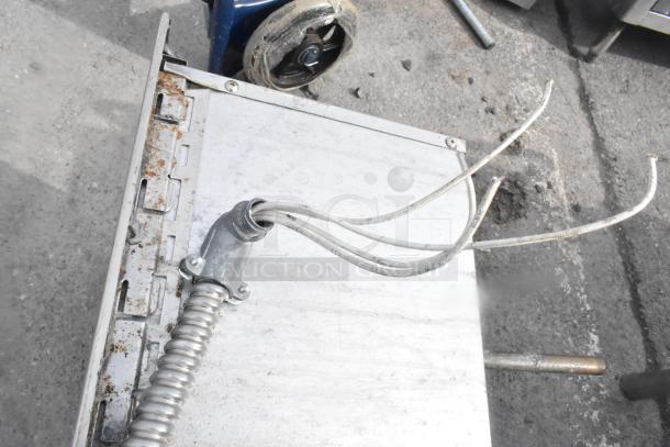 Commercial 2 Well Drop In, used condition, visible wiring and metal casing, minor rust on edges.